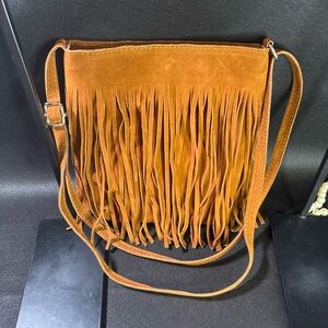 Source Unknown Suede Fringe Crossbody Bag in Tan about 8” w, 9” tall and 2” wide